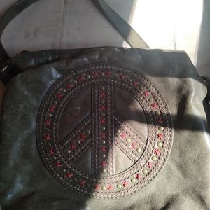 The Sak peace sign purse olive green color.